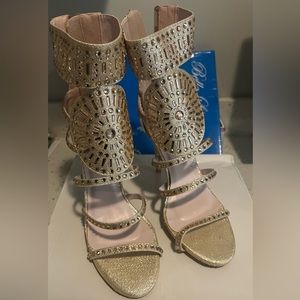 Gold shoes with pink rhinestones